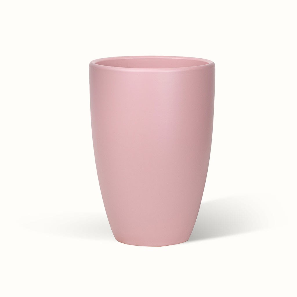 Lyserød Classic-potteskjuler med glat overflade og en form, der bliver smallere mod bunden.